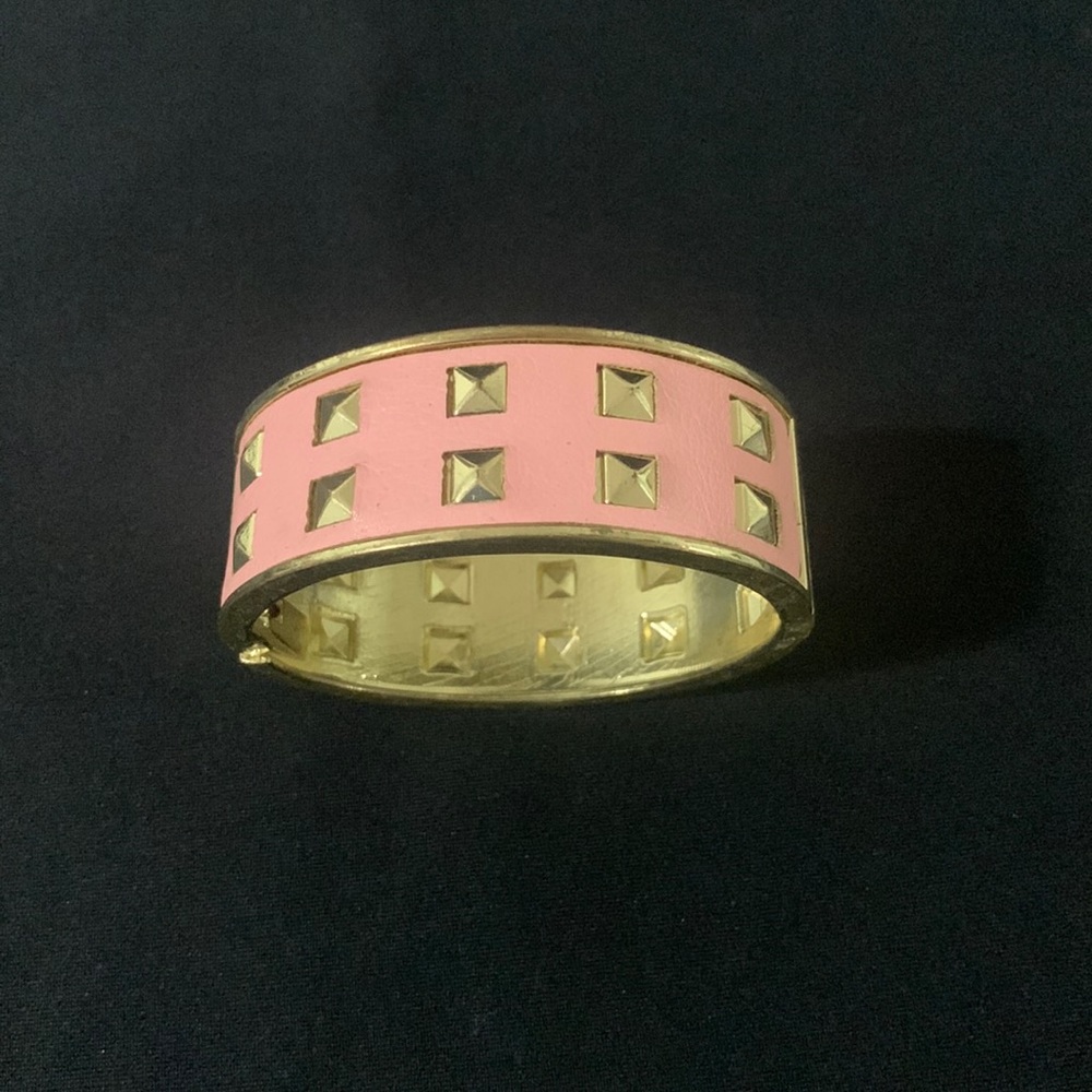 Pink and gold bangle bracelet with gold pranks studs